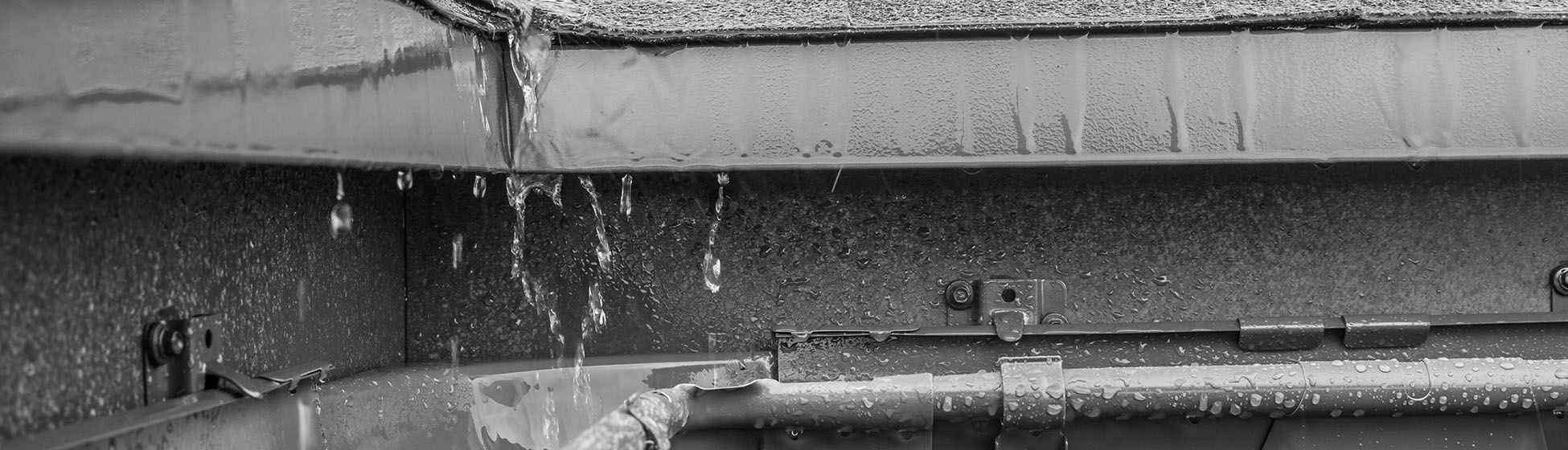 Installation recuperateur eau de pluie sur gouttiere